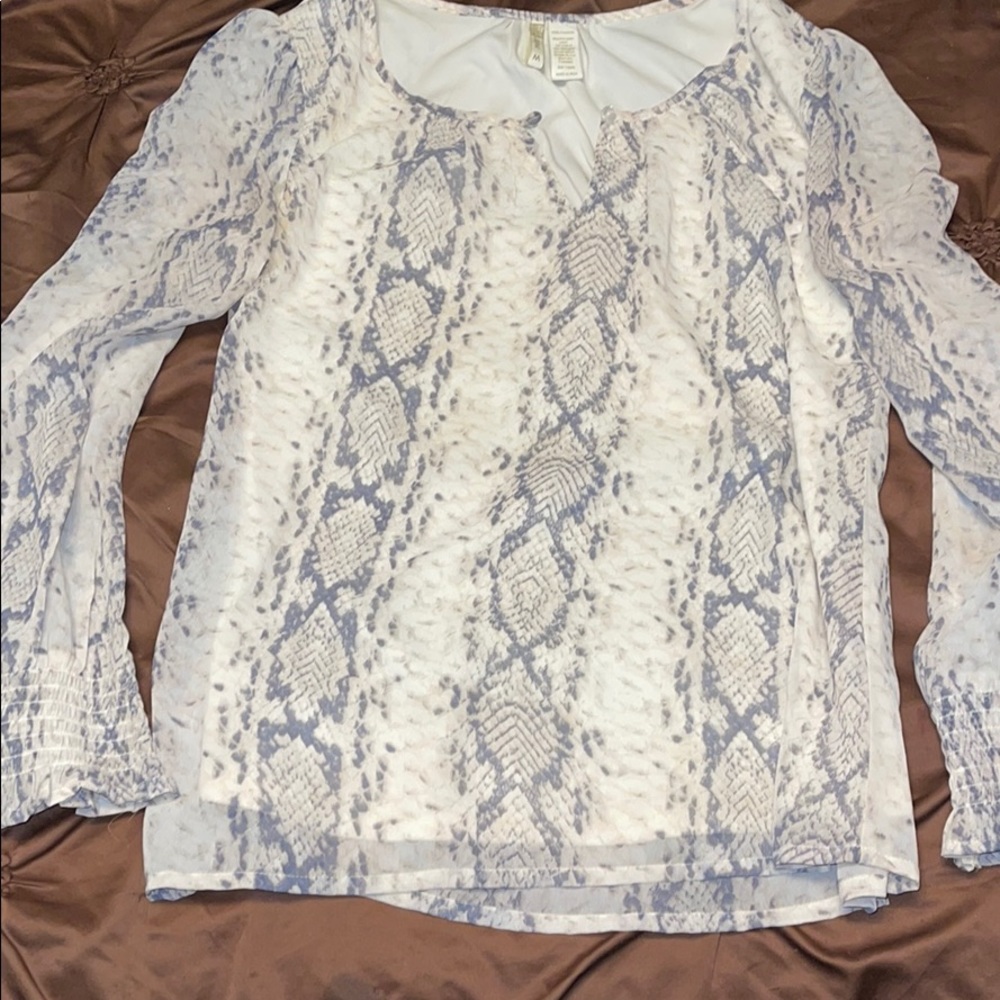 Woman’s snake print top
